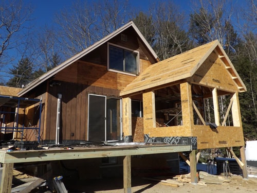 Home addition exterior framing with board and batten siding under construction