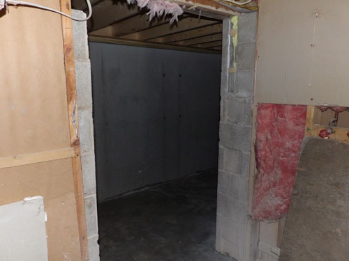 Basement renovation with new block wall doorway and framing